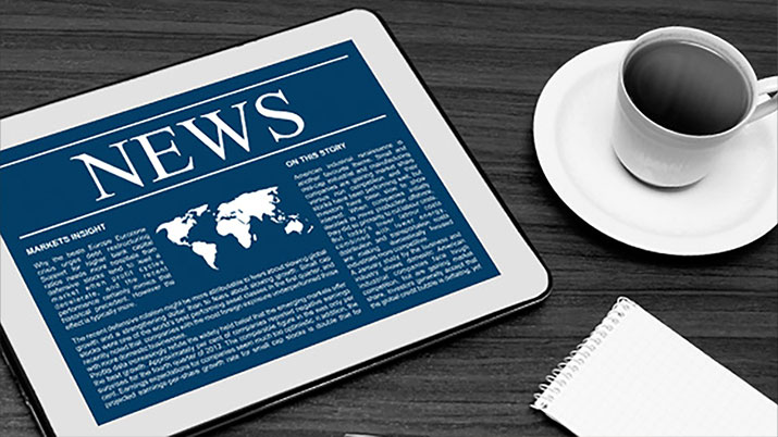 News Media Resources cup of coffee and a tablet with news article