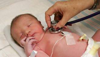infanthospital330px.jpg Doctor listening to baby's heart.