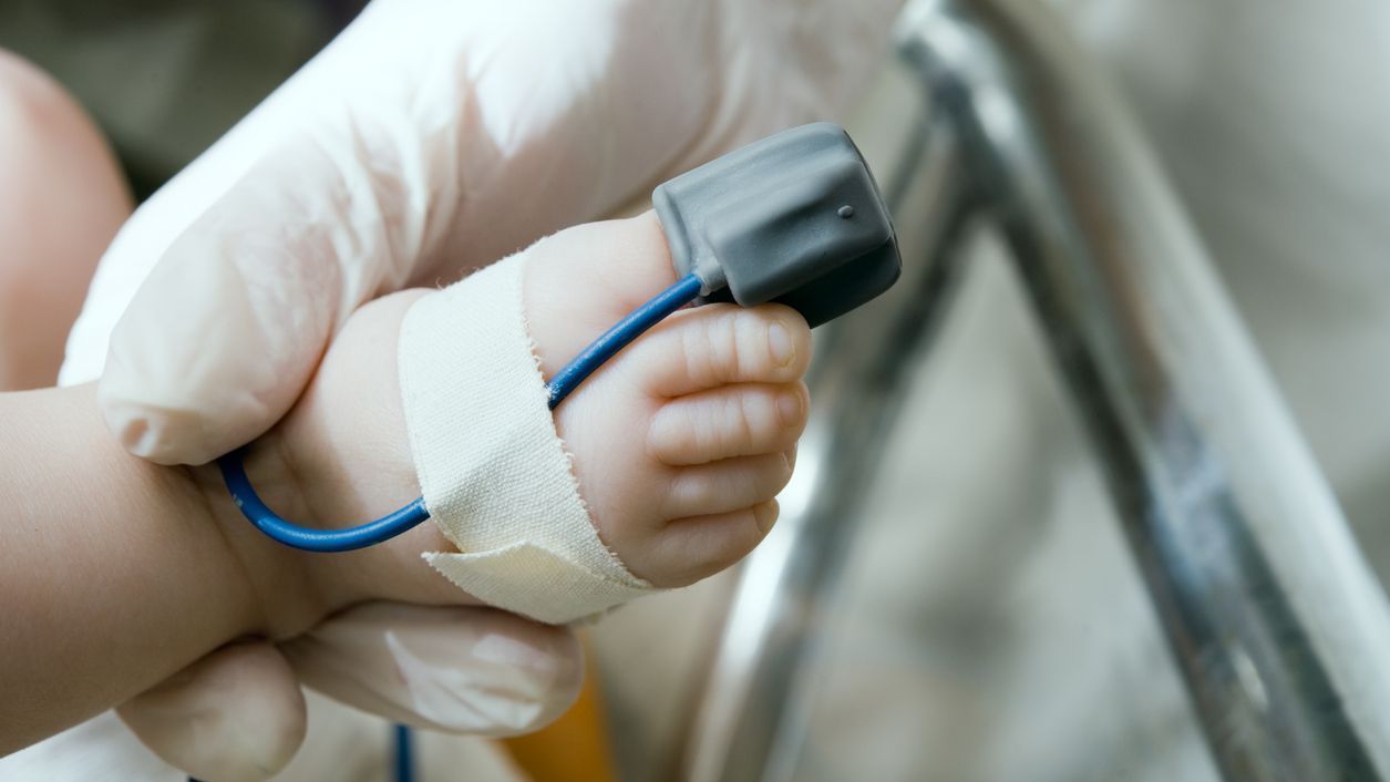 A pulse oximeter on a baby's foot A pulse oximeter on a baby's foot