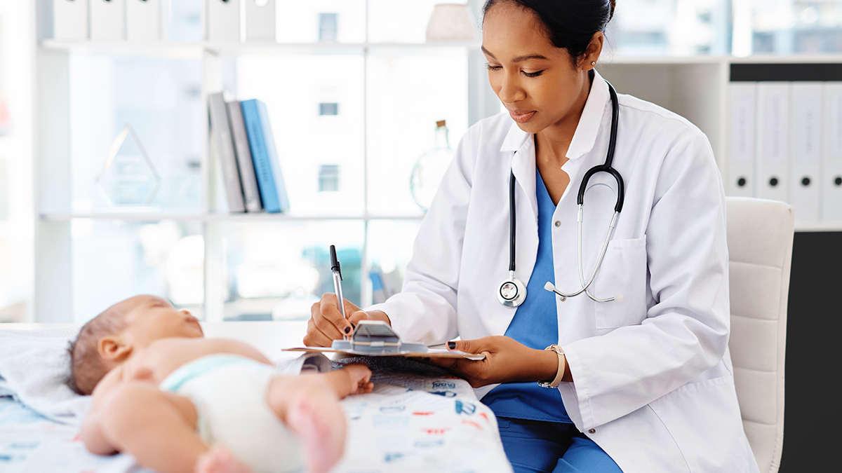 Guidelines for Post-Vaccination Serologic Hepatitis B Testing Thumbnail A doctor examining a newborn baby and making notes on her clipboard