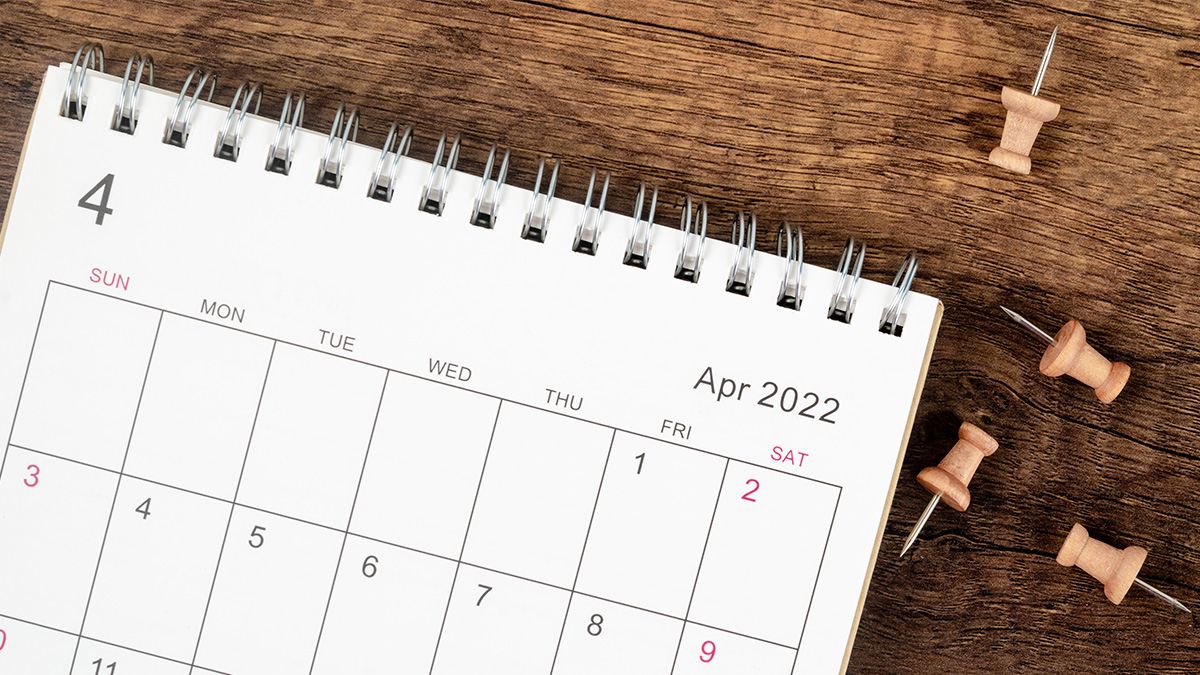 Multistate Outbreak of Hepatitis A from Fresh Organic Strawberries When People Got Sick Thumbnail A calendar sitting on top of a desk showing April 2022 with four thumb tacks to the right of it