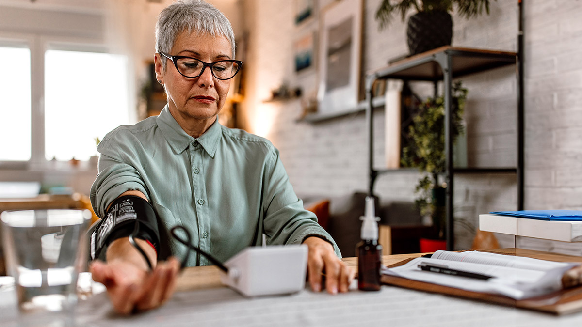 — title missing — Older woman self-monitoring blood presure