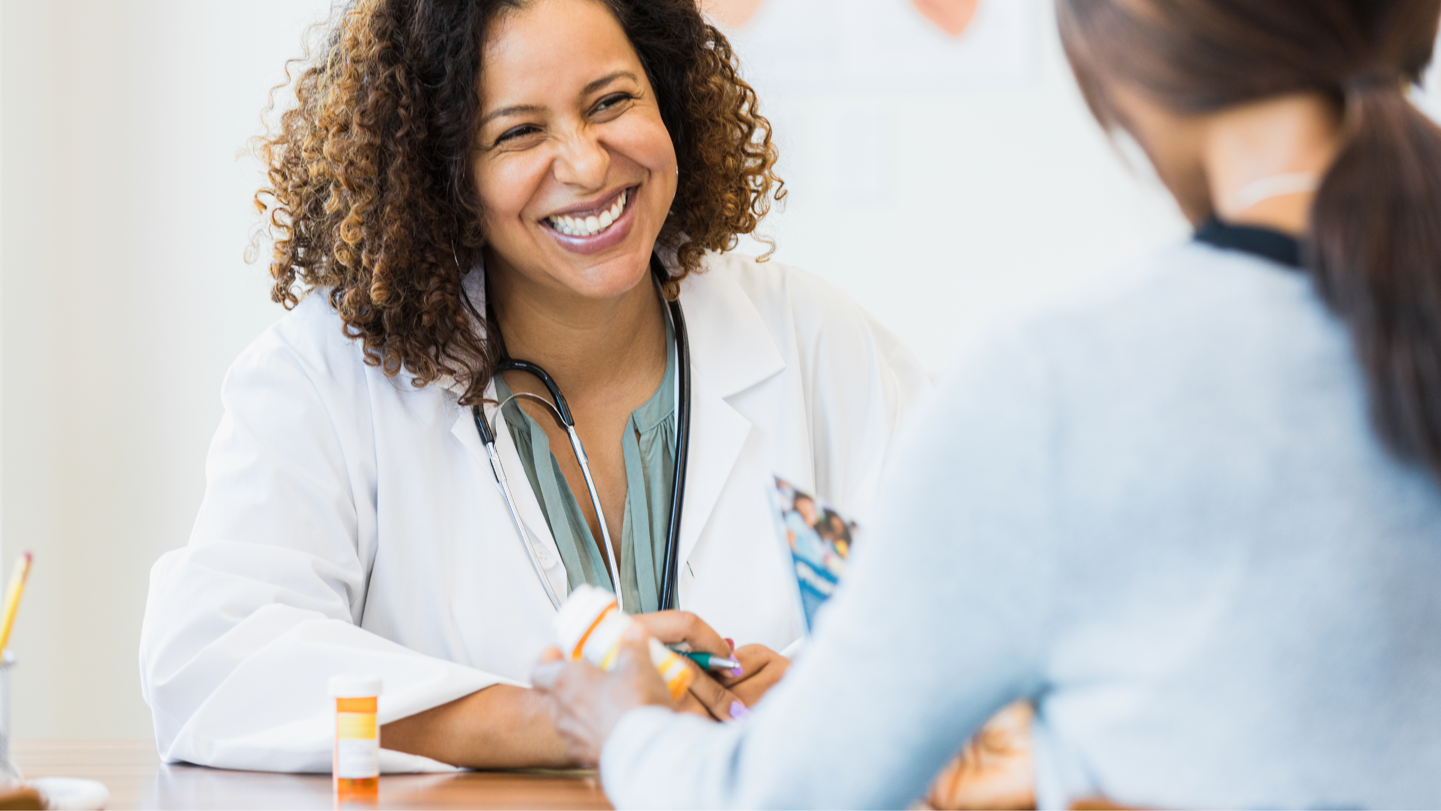 Thumbnail for PEP A smiling health care provider facing a patient.