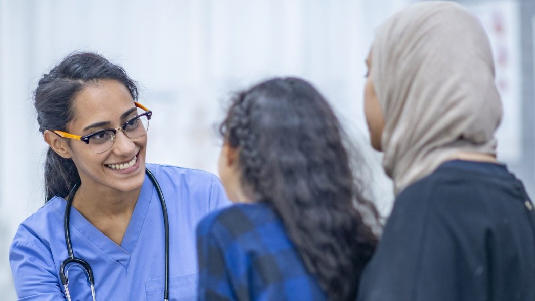 CDC's role in immigration mother daughter with doctor