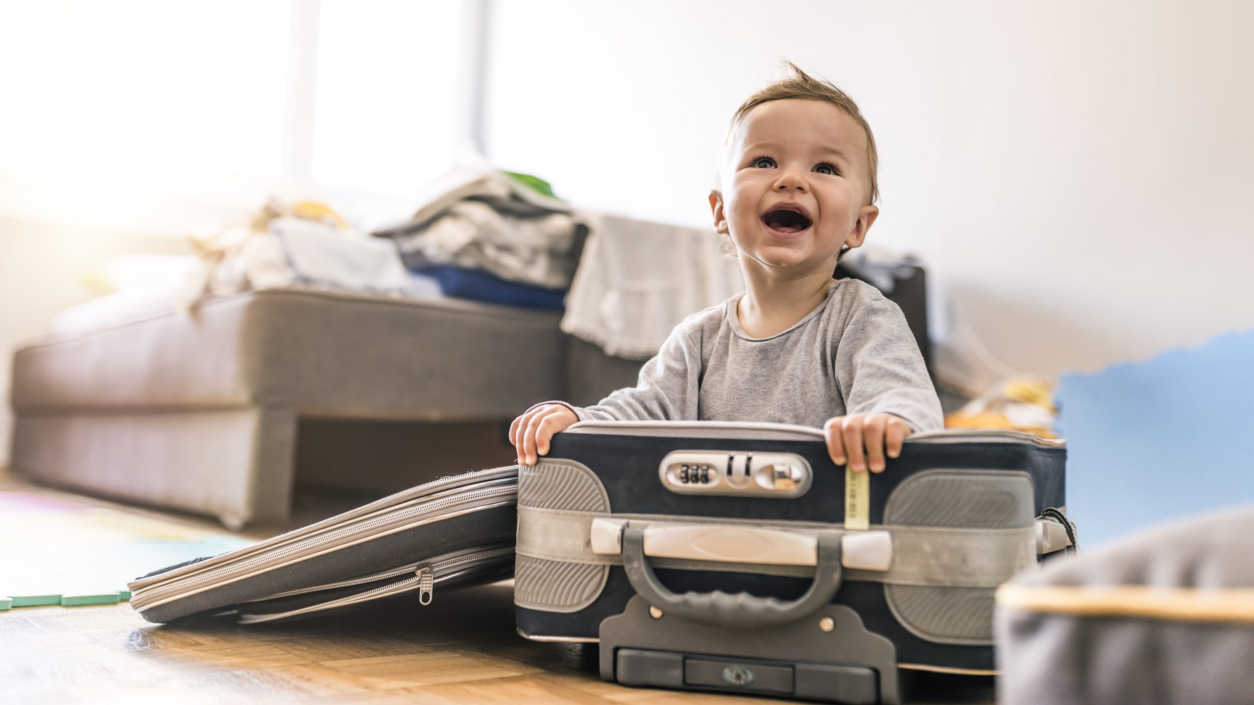 — title missing — Baby in a suitcase.