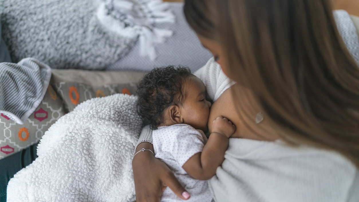 Newborn Breastfeeding A newborn baby breastfeeds