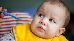 picky eaters An older infant grimacing.