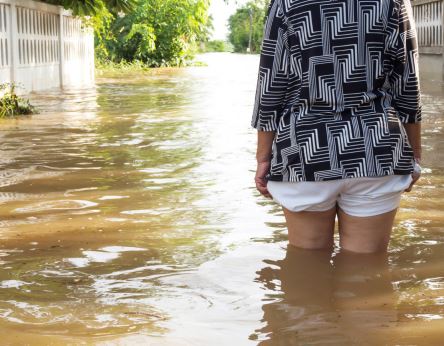 woman walking in flood water