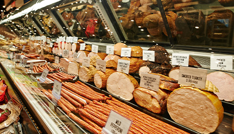 Representative image Display case in a store containing deli meats and cheeses.