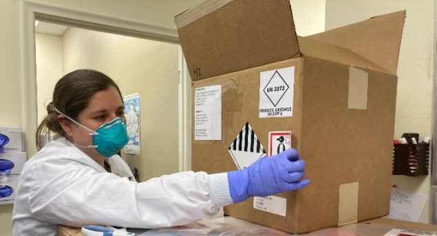 LLS fellow Jessica Prince-Guerra An LLS fellow examines a box of hazardous material.