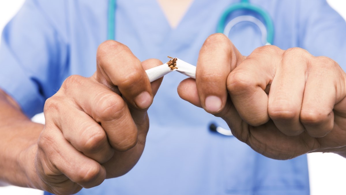 Doctor Breaks Cigarette a doctor breaking a cigarette