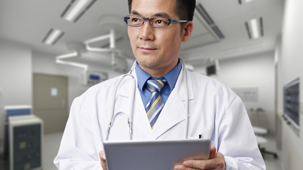 Doctor Tablet a doctor holding a digital tablet