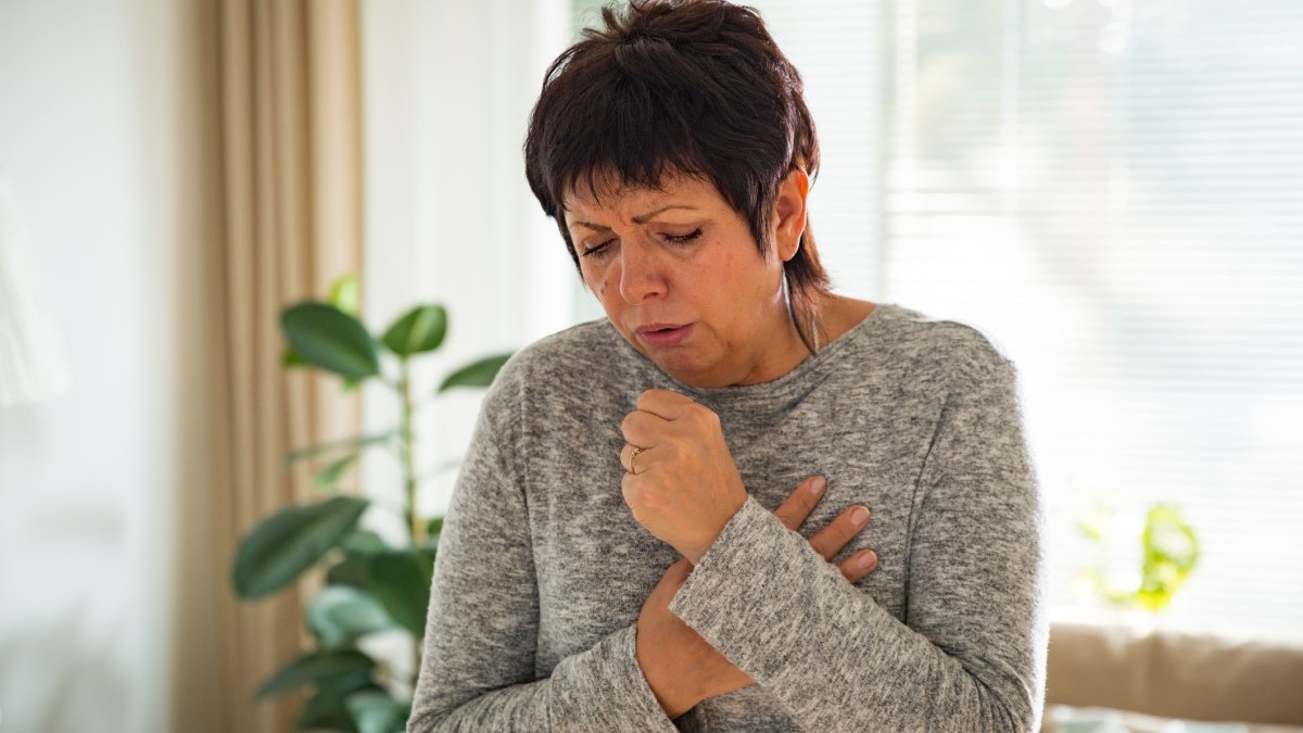 Woman Coughing Photo of a woman coughing