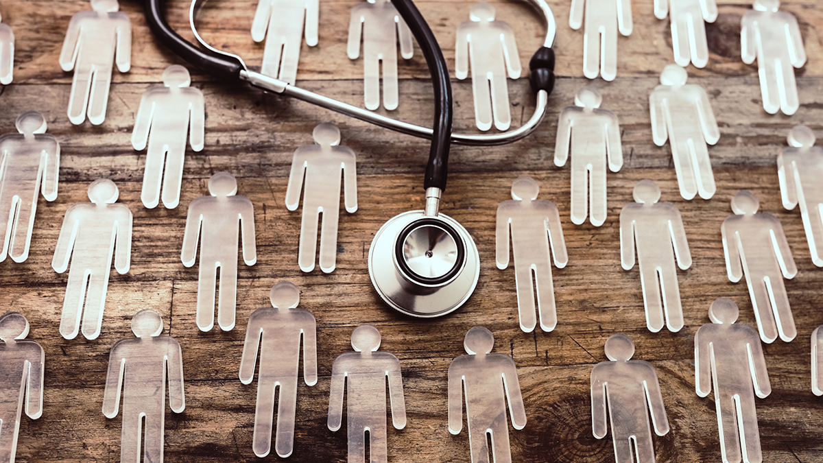 Epidemiology Transparent figurines and stethoscope on wood background