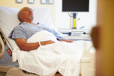 signs-symptoms.jpg man in hospital bed