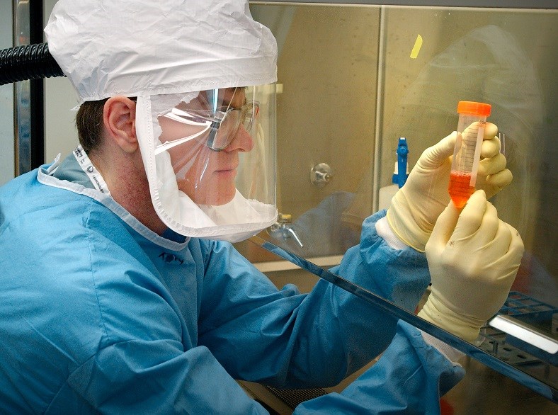 CDC lab worker checking samples.