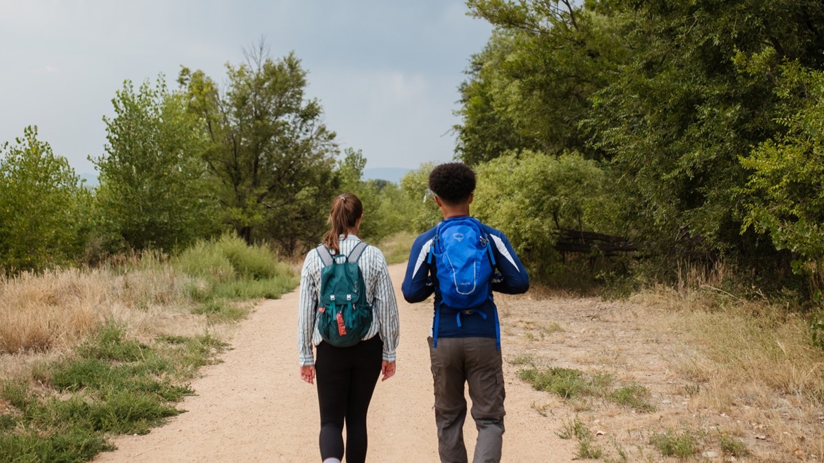 Protective clothing Photo showing two people hiking in protective clothing to prevent mosquito bites.