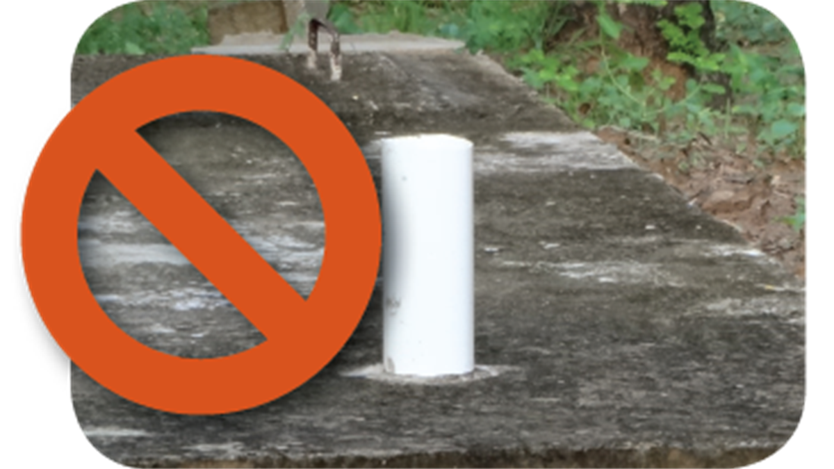 — title missing — An uncovered septic tank ventilation pipe sticks above the groun.
