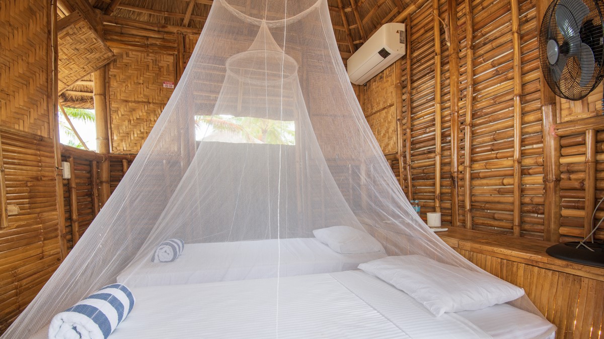 Mosquito Nets for Beds Travelers can use mosquito nets when sleeping to protect themselves from bites.