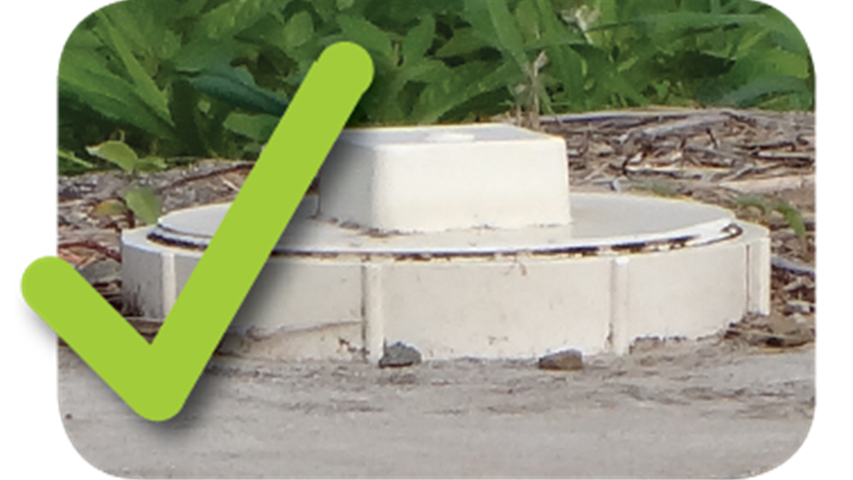 — title missing — A septic tank with a PVC cap. A check mark is added.