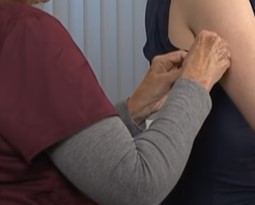 Subcutaneous vaccination Nurse gives a patient a bandage after subcutaneous injection