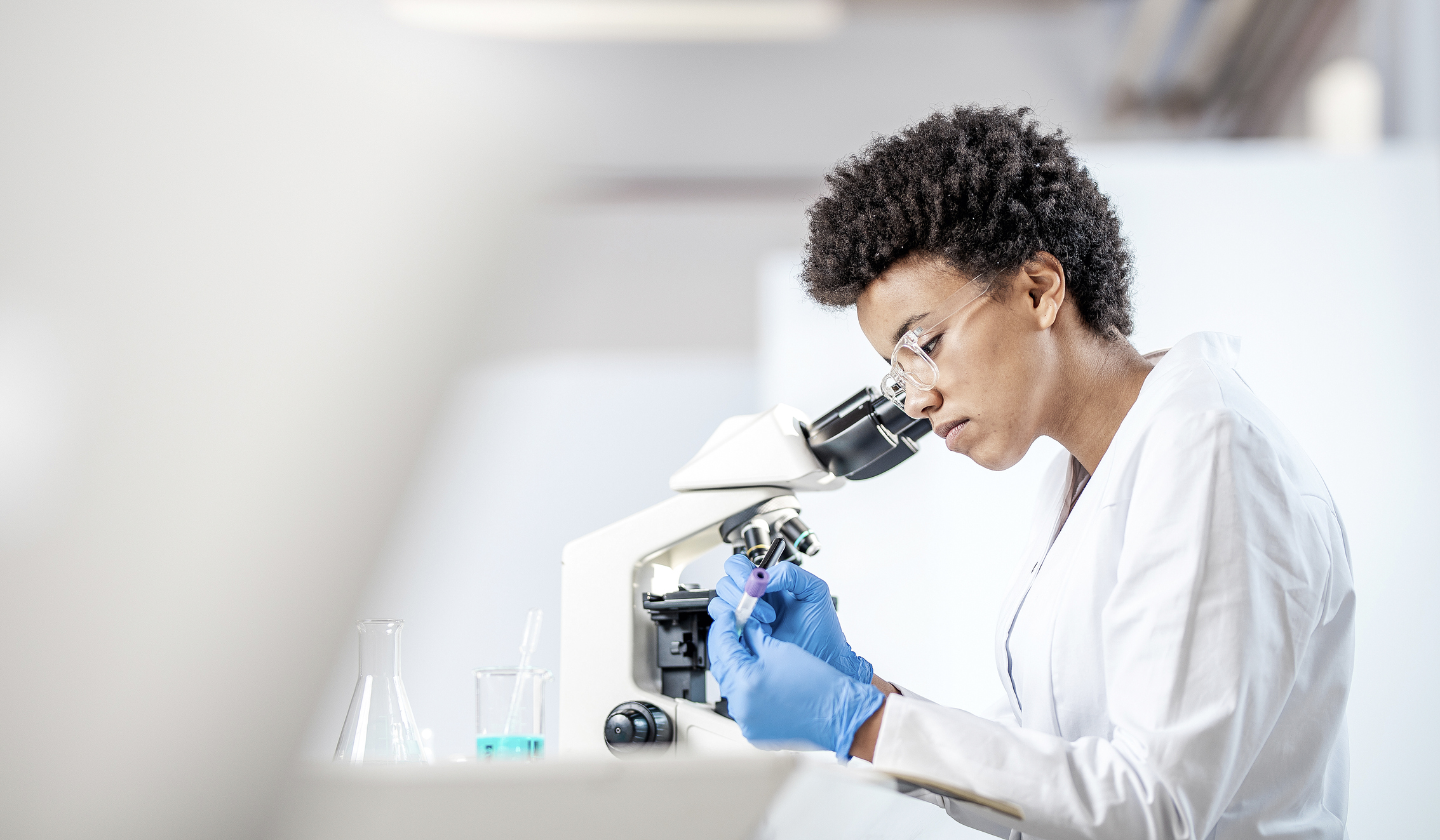 Young Scientist Working in The Laboratory Woman scientist working in a laboratory