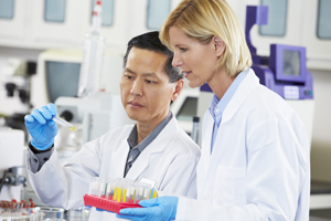 scientists-in-lab-300px.jpg Two scientists in lab, observing a sample together