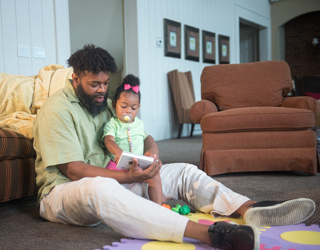 LTSAE Milestones dad reading Dad reading daughter book