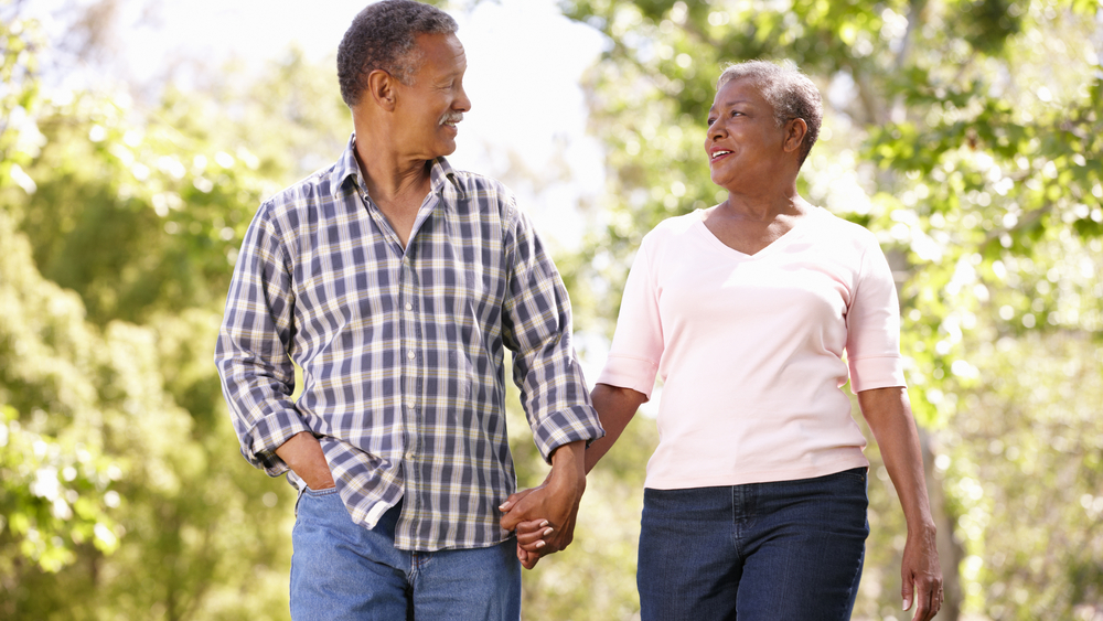 — title missing — Middle aged man and woman walking