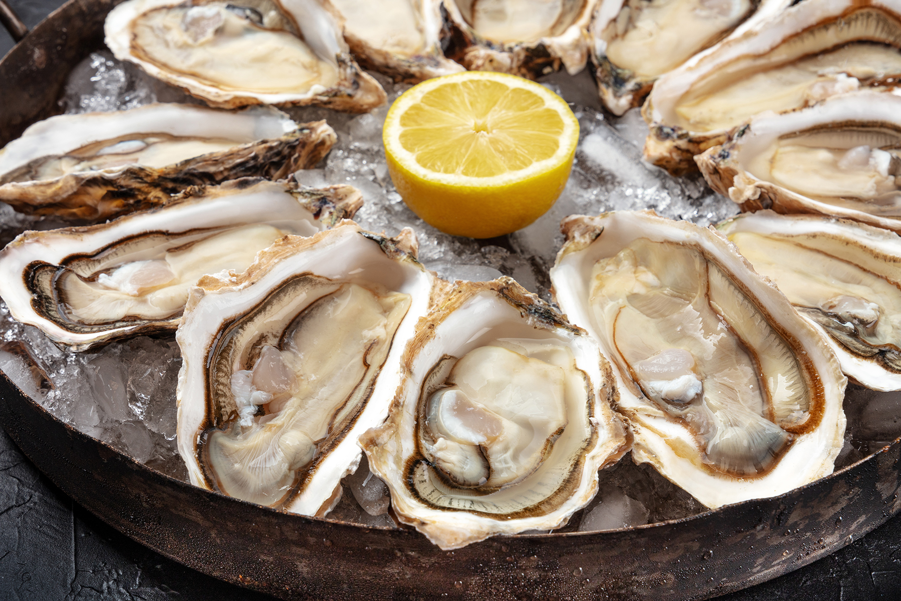 Raw oysters Photo of raw oysters on a platter.
