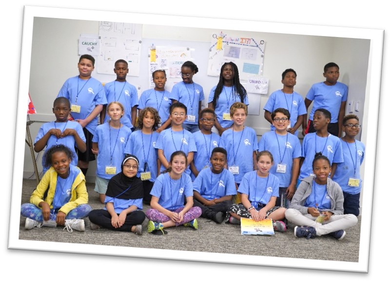 prev3 2018 camp group photo showing 20+ campers in matching baby blue shirts.