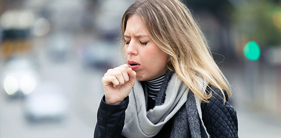 woman-coughing woman coughing outside