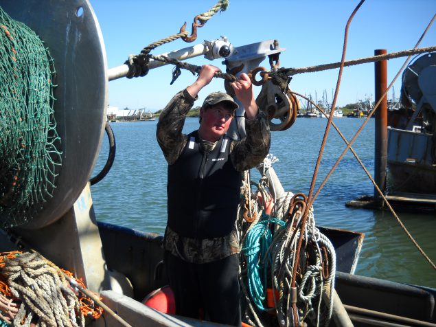 2015-119-large 12-year commercial fishing veteran Brett Smith works the line in the 'Rogue' flotation vest created by Kent Safety Products. Photo courtesy of Kent Safety Products.