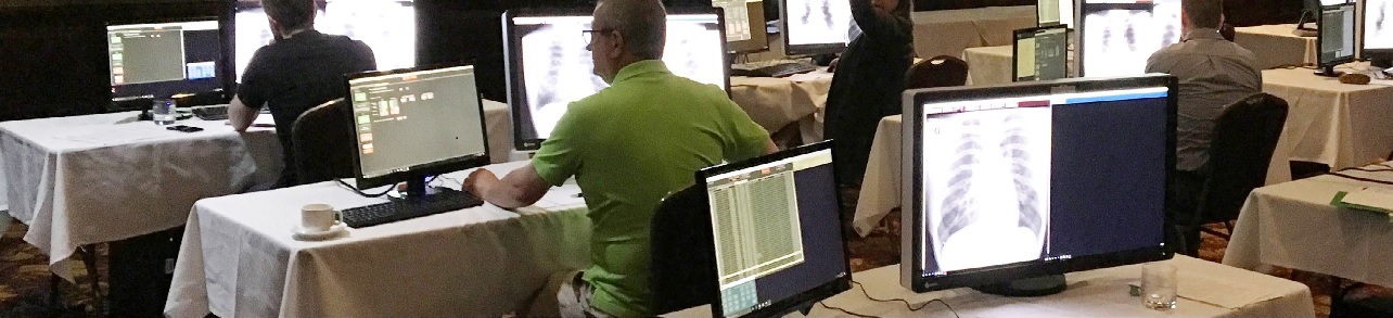 b-reader banner students seated at a computer in a conference