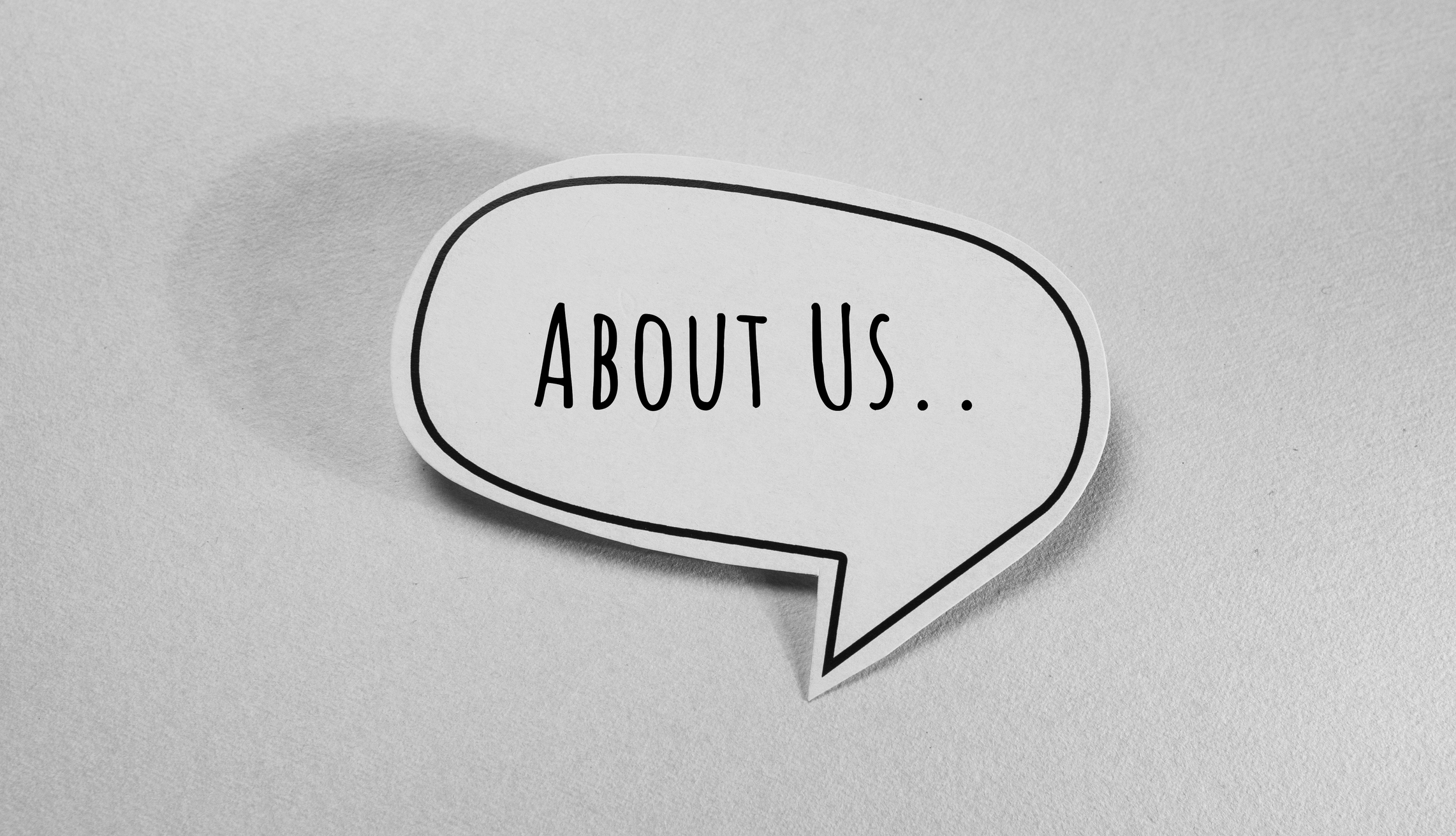 Behind the Wheel at Work Vol 9 No 1 Speech bubble with "About Us" text