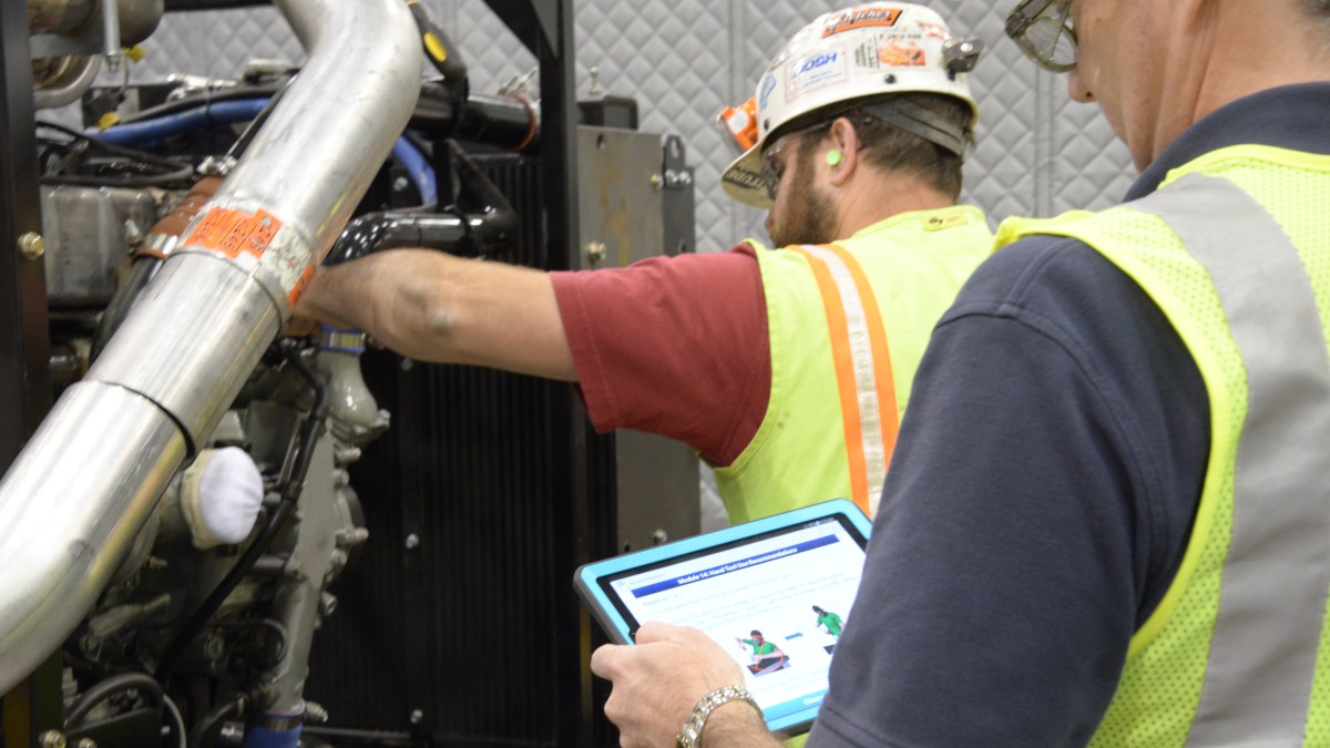 ErgoMine1200x675.jpg Supervisor observing a worker while using an audit tool