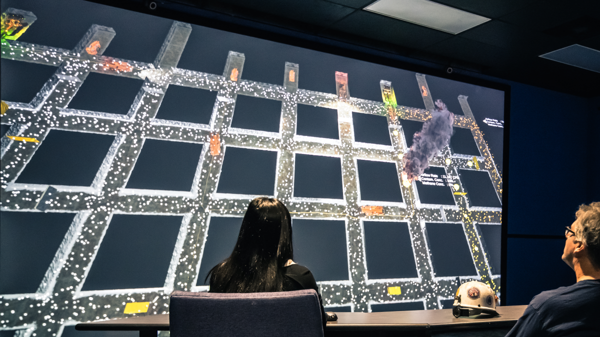 Users of MFIRE viewing visualization of a simulated mine fire