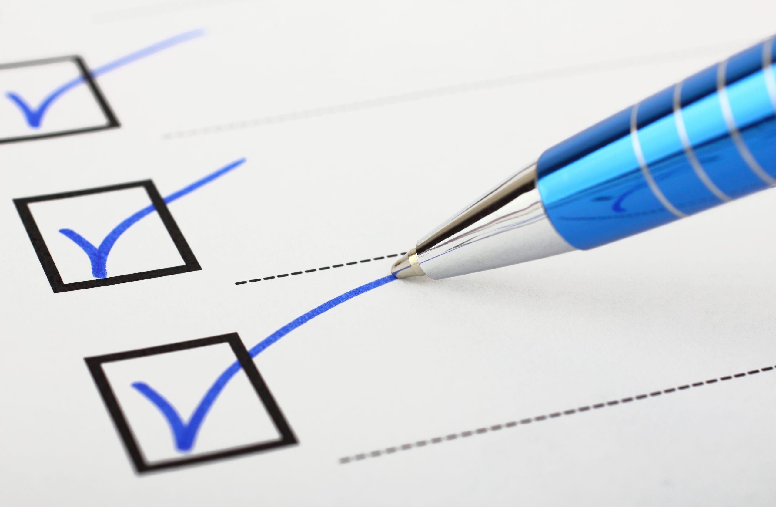 Image of a pen and checklist