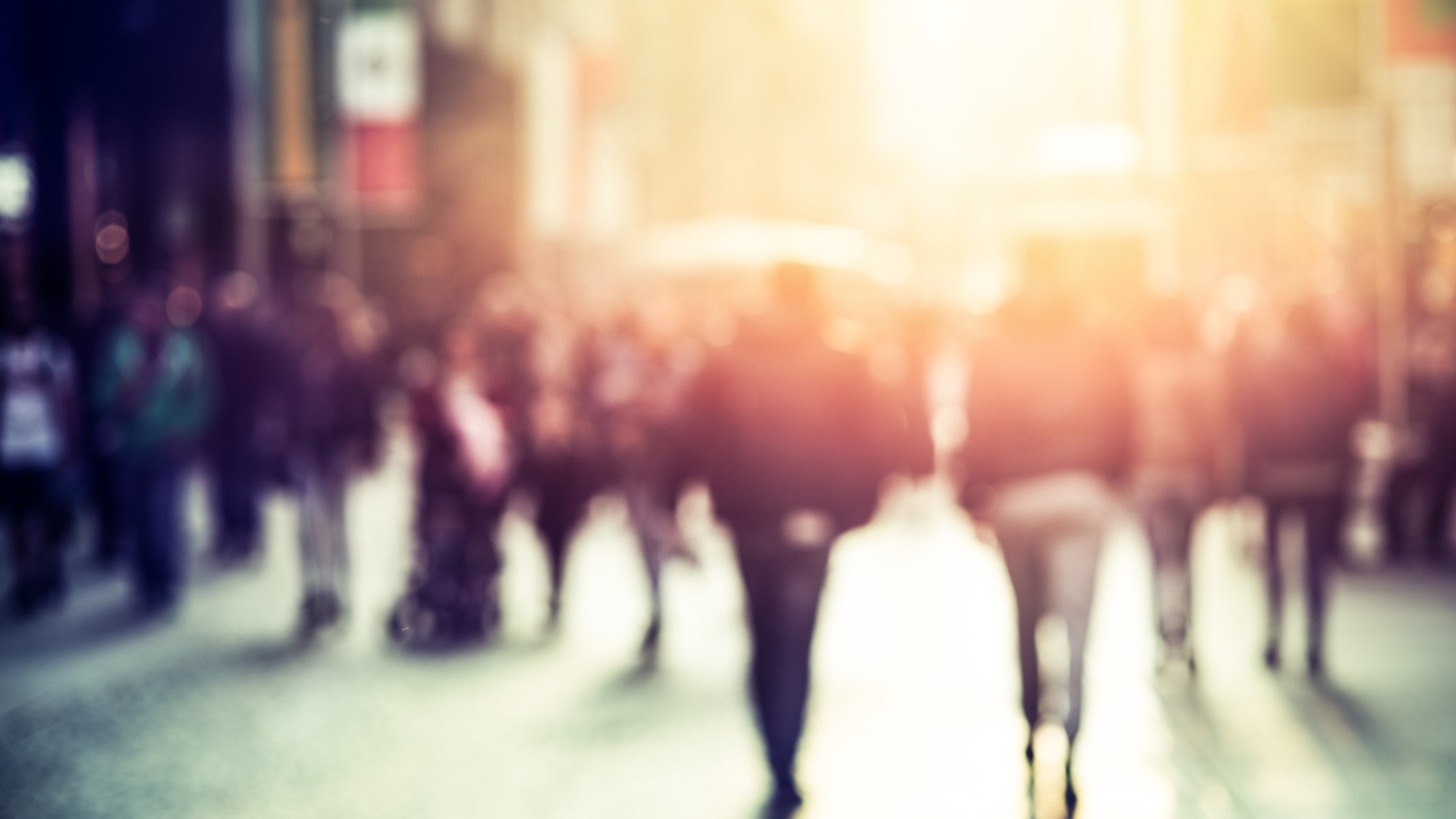 — title missing — People walking down a city street.