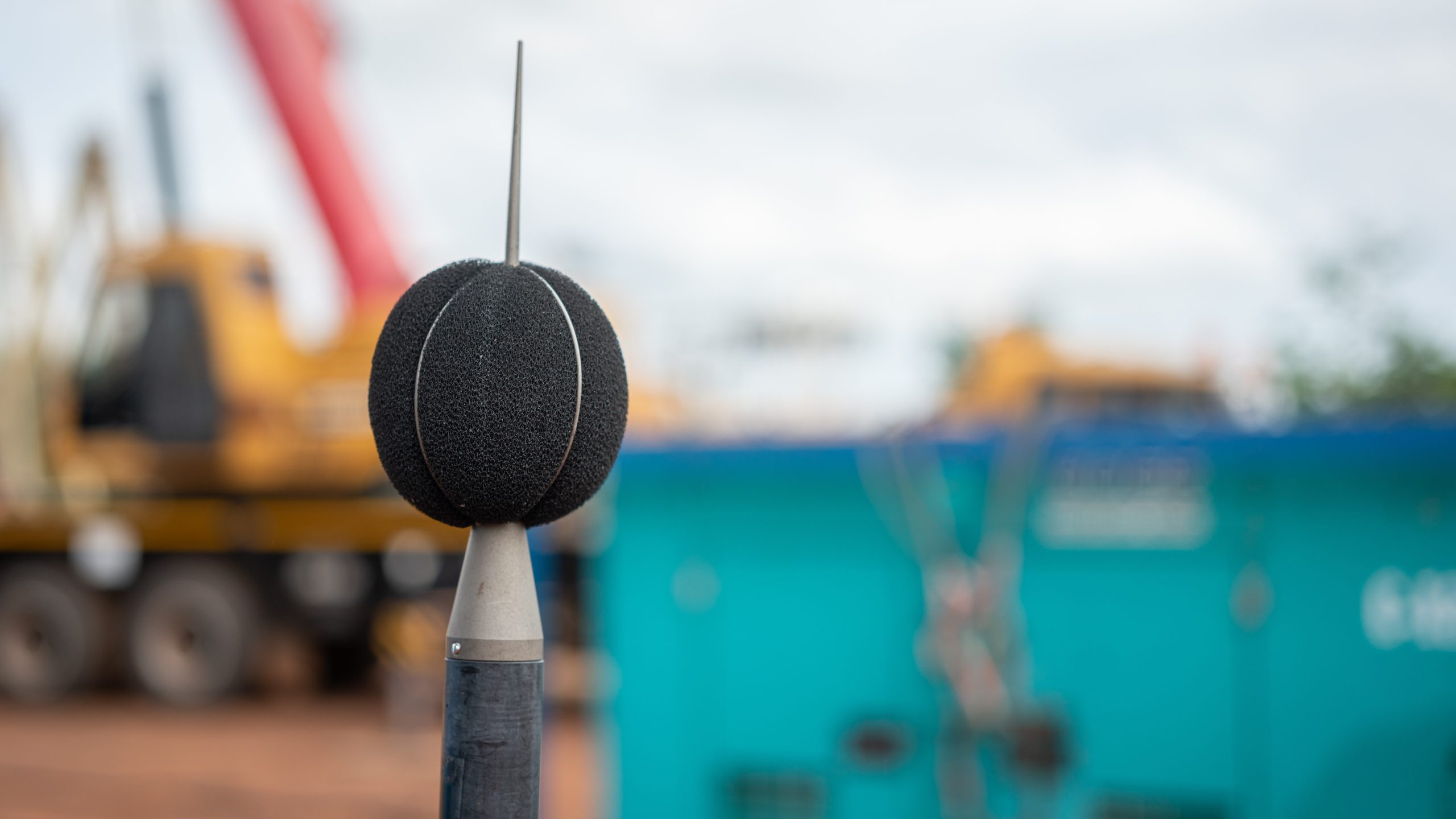 Noise Survey A sound recording equipment using to measuring noise level with blurred background of construction working place