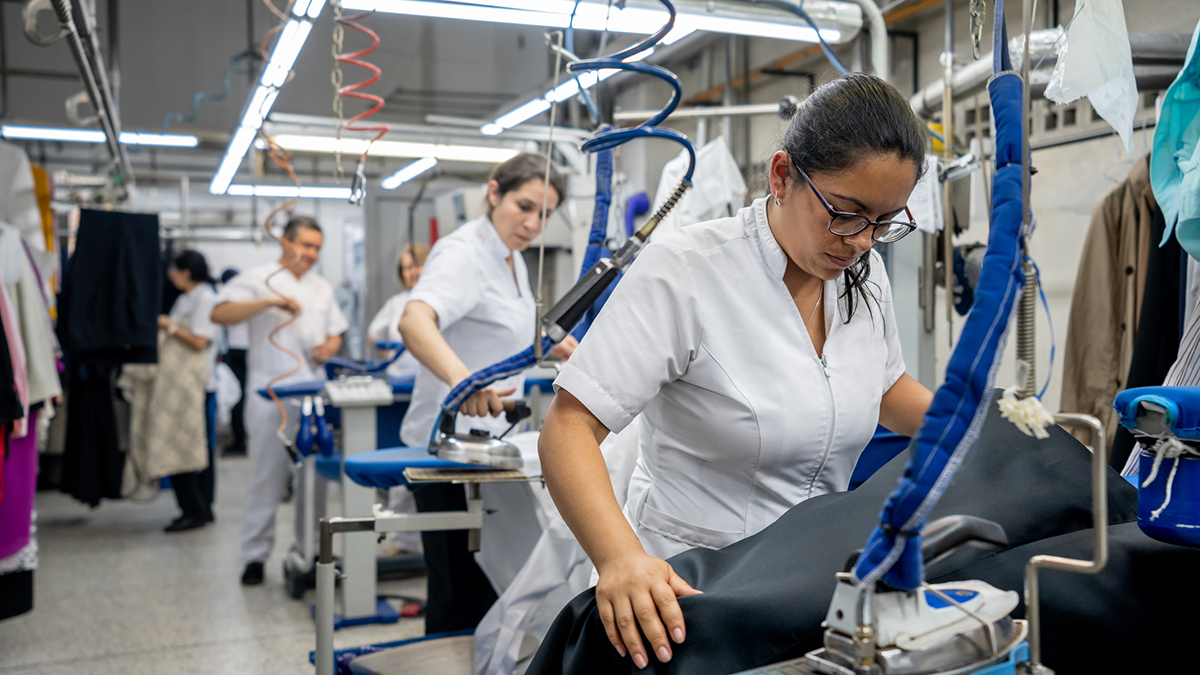 — title missing — Female working in a drycleaning facility