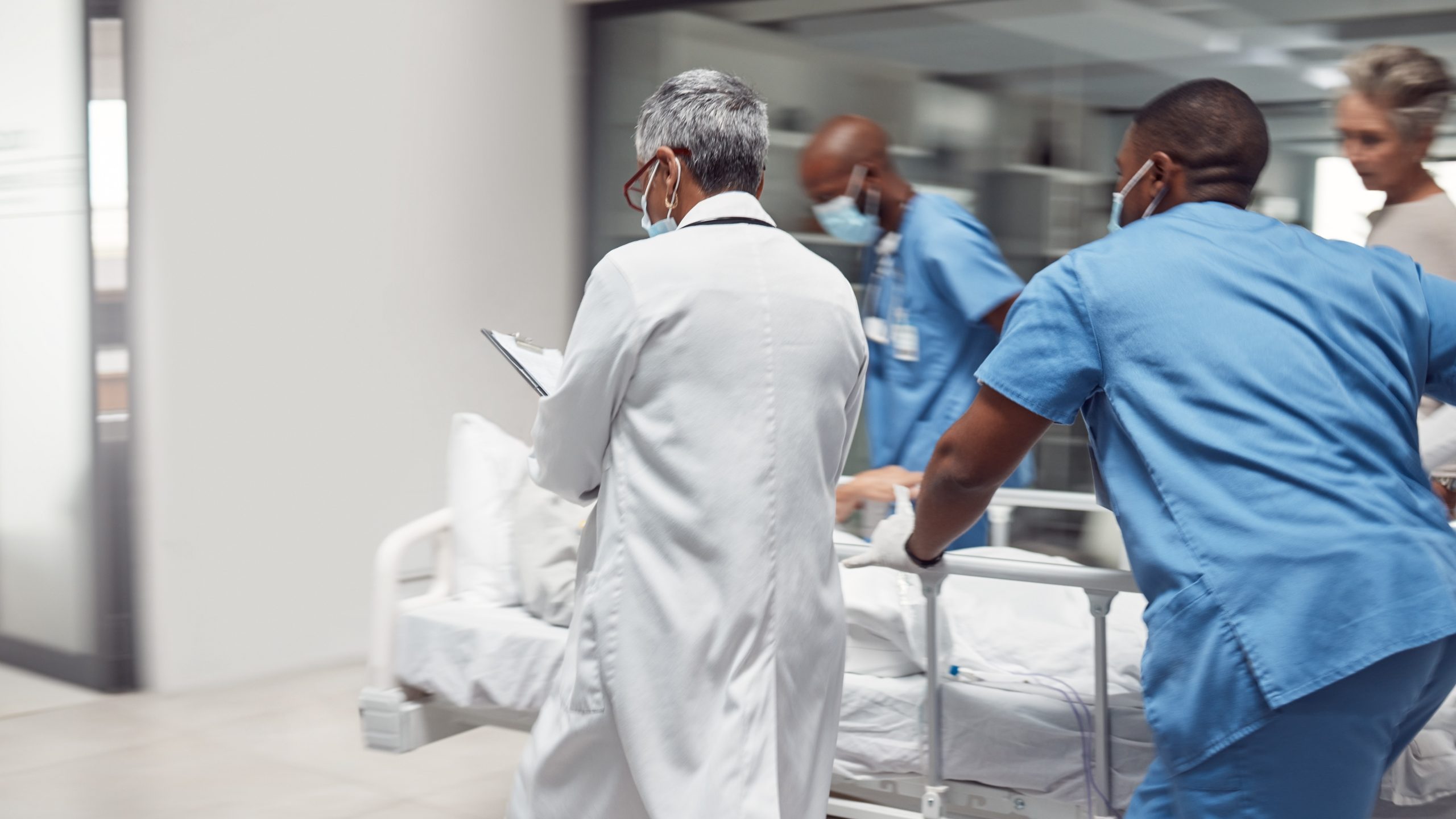 — title missing — Doctors rush with patient, surgery and ready for procedure in hospital.