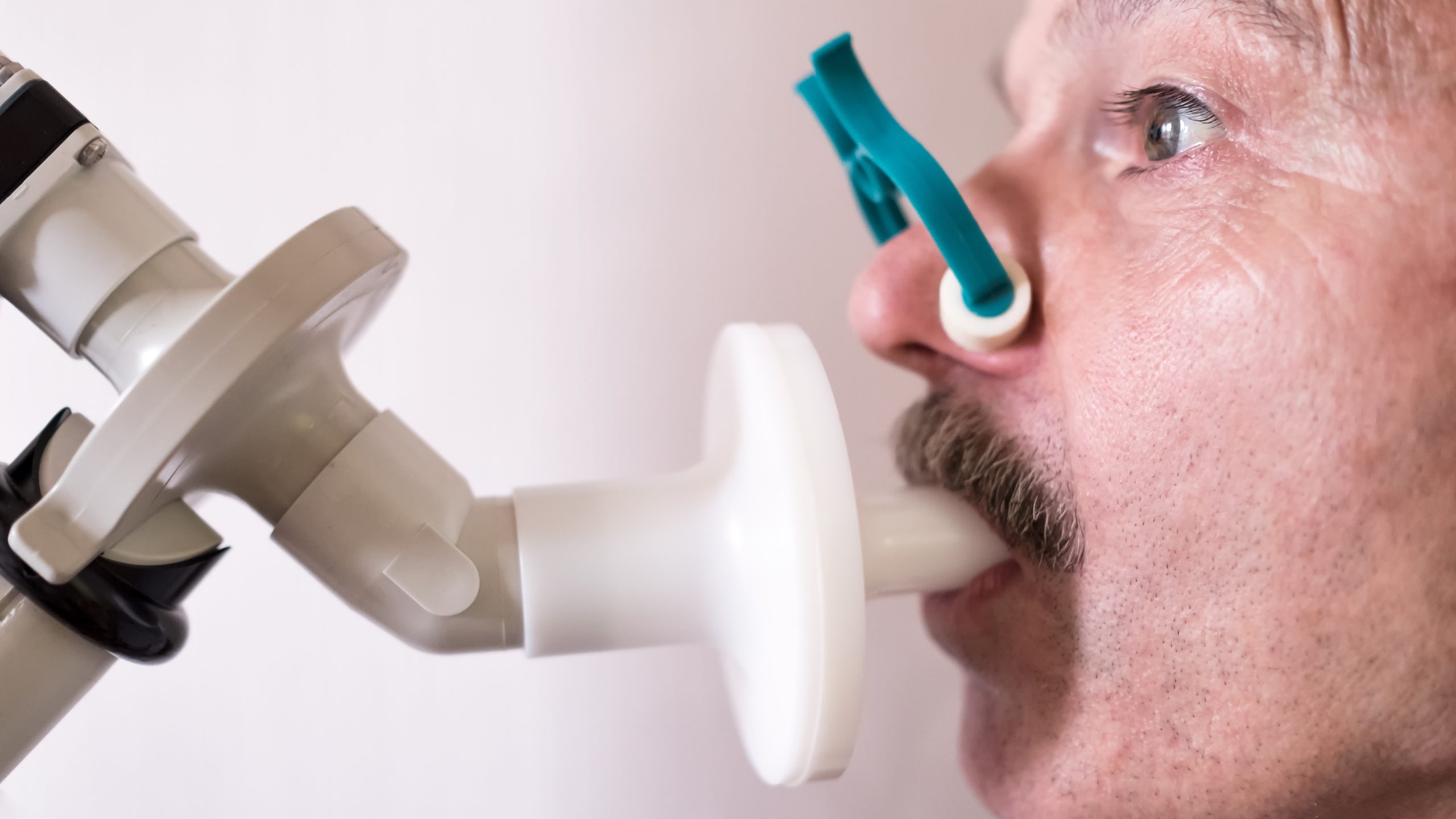 — title missing — Close up of a male performing spirometry.