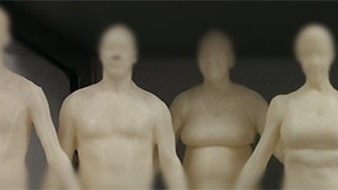 — title missing — Four mannequins of various sizes stand in a row.