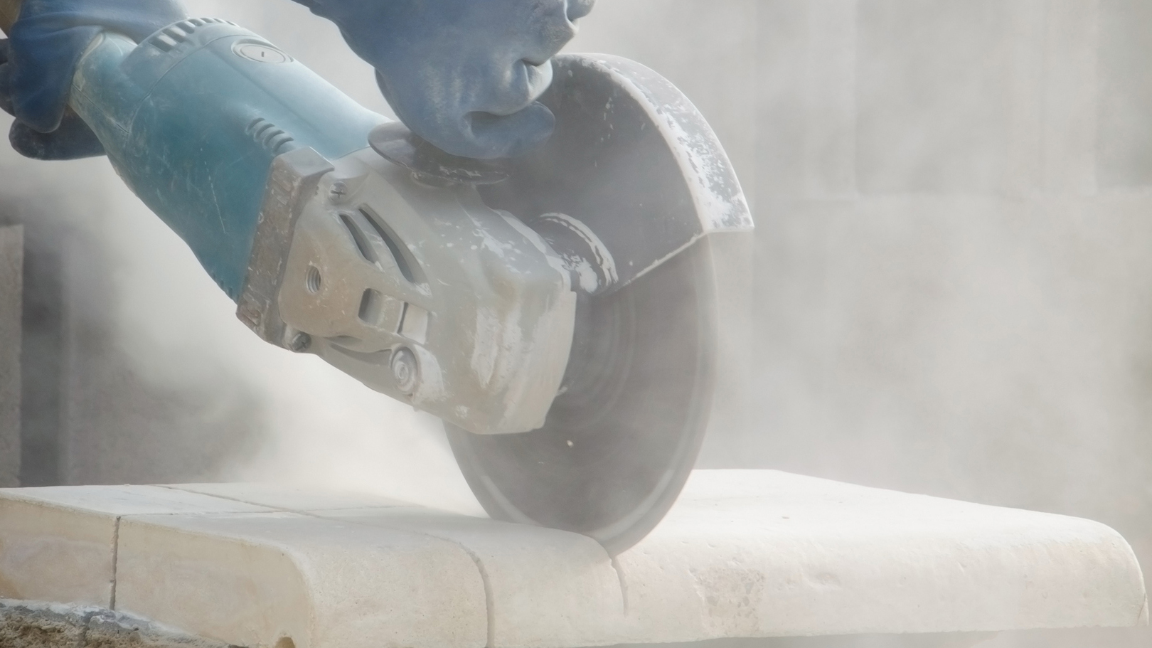 — title missing — Close up of stone cutting with dust.