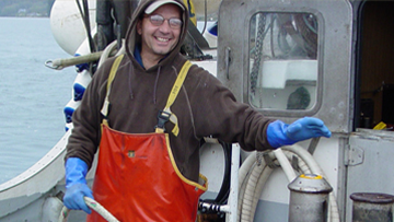 onboardhazardsthumbnail.png A fisherman simulates the activation of the winch-mounted emergency stop system on the deck of the salmon purse seiner. Photo by NIOSH