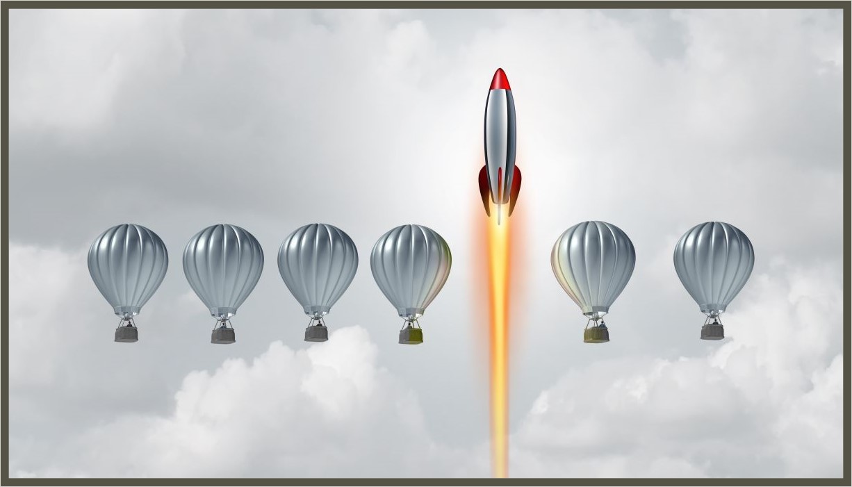 — title missing — Image of 6 hot air balloons in a line in the sky with white clouds. A rocket ship is between the 4th and 5th balloon.