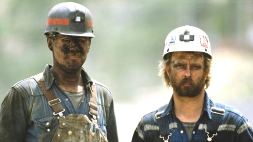 — title missing — Two coal miners with coal dust on them.