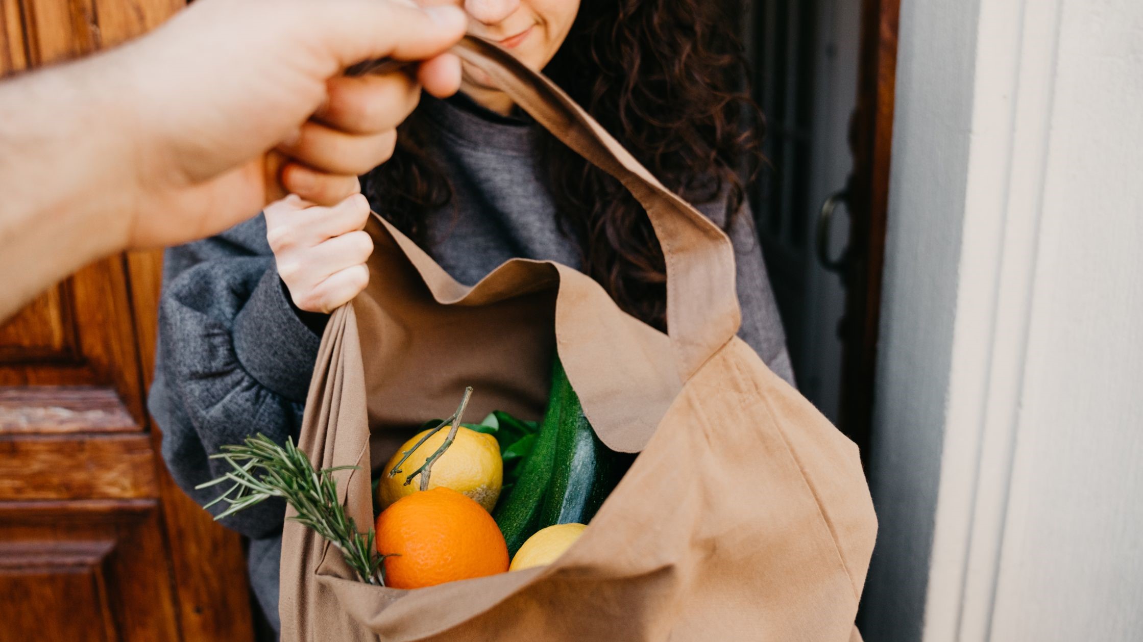 Delivery bag of fruits and vegetables Delivering paper bag with fruits and vegetables.