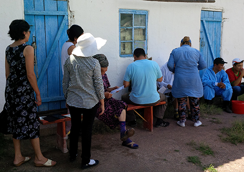 residents-participatin-for-blood-drawn Residents randomly selected for participation in the serosurvey line up outside the local health department to get their blood drawn by a nurse from the Zhambyl regional health department.